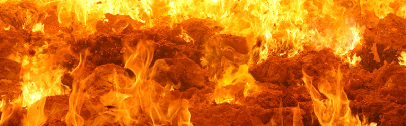 Flaming waste on grates