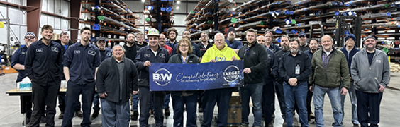 employees at copley service center holding target zero safety banner