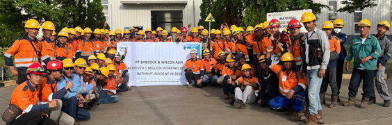 large group of PTBWA service team holding safety banner