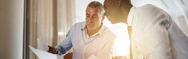 two men reviewing document