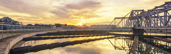 walkway and bridge over body at sunrise