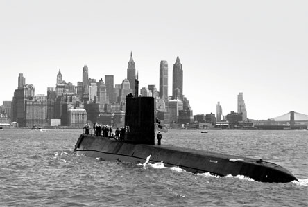 Nautilus submarine on water surface with city in background Babcock Wilcox
