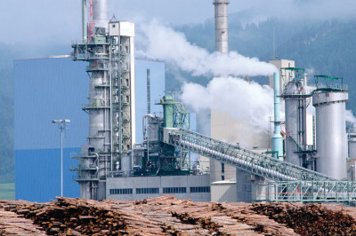 Recovery Boiler at pulp mill with logs in foreground Babcock Wilcox