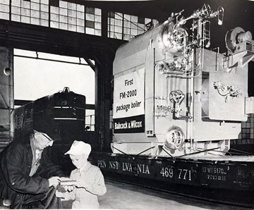 first FM Boiler by Babcock Wilcox with adult and child in foreground