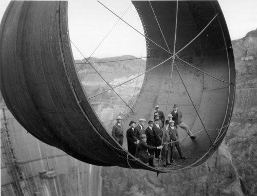 group standing in penstock suspended over Hoover Dam 1932 Babcock Wilcox