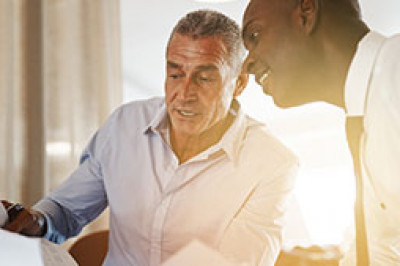 two men reviewing document
