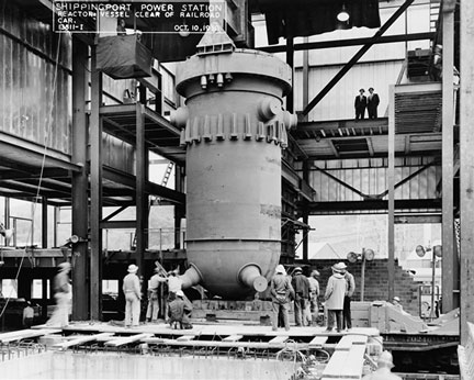 workers at base of vessel in Shippingport 1957 Babcock Wilcox