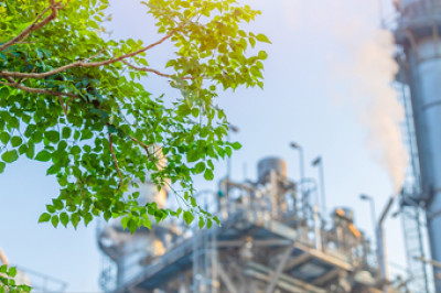 power plant with tree in foreground cropped