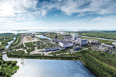 Industrial facility situated next to a waterway and a bay 