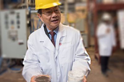 Man in in a hard hat and lab coat
