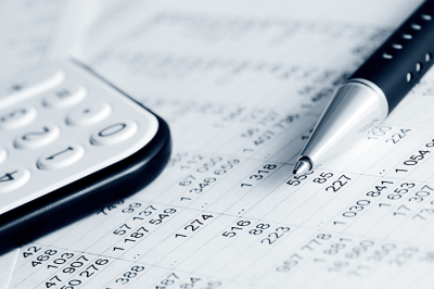 Pen and calculator resting on a paper