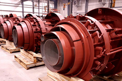 Row of industrial burners on pallets inside a warehouse