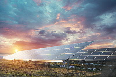 Solar panels under a cloudy sky