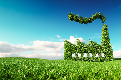 stylized image of a power plant made entirely of green leaves sitting in a field of grass