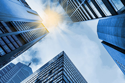 tall buildings in a city as viewed from street level